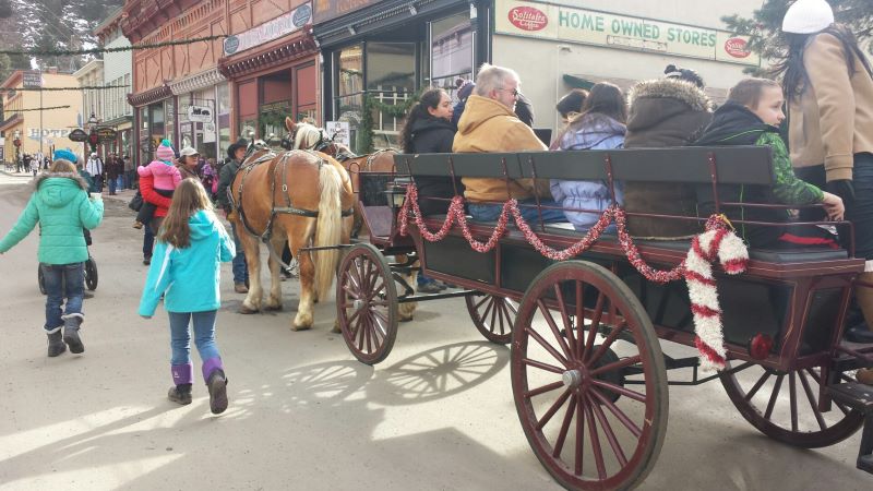 people sitting on a cart 