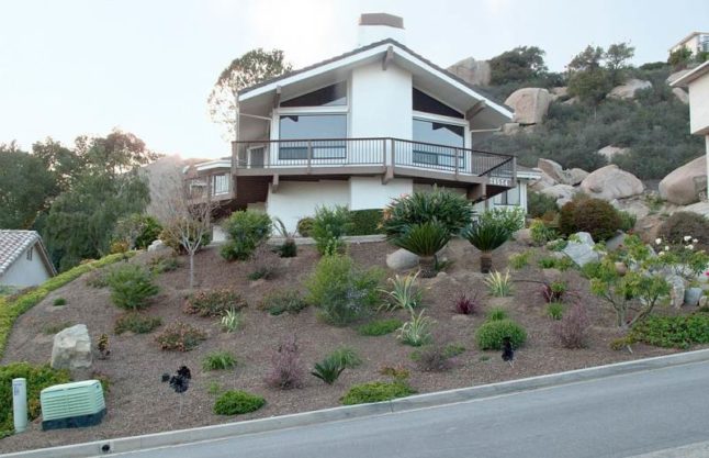 A private house with a xeriscape instead of a front lawn. Hidden Meadows, California.