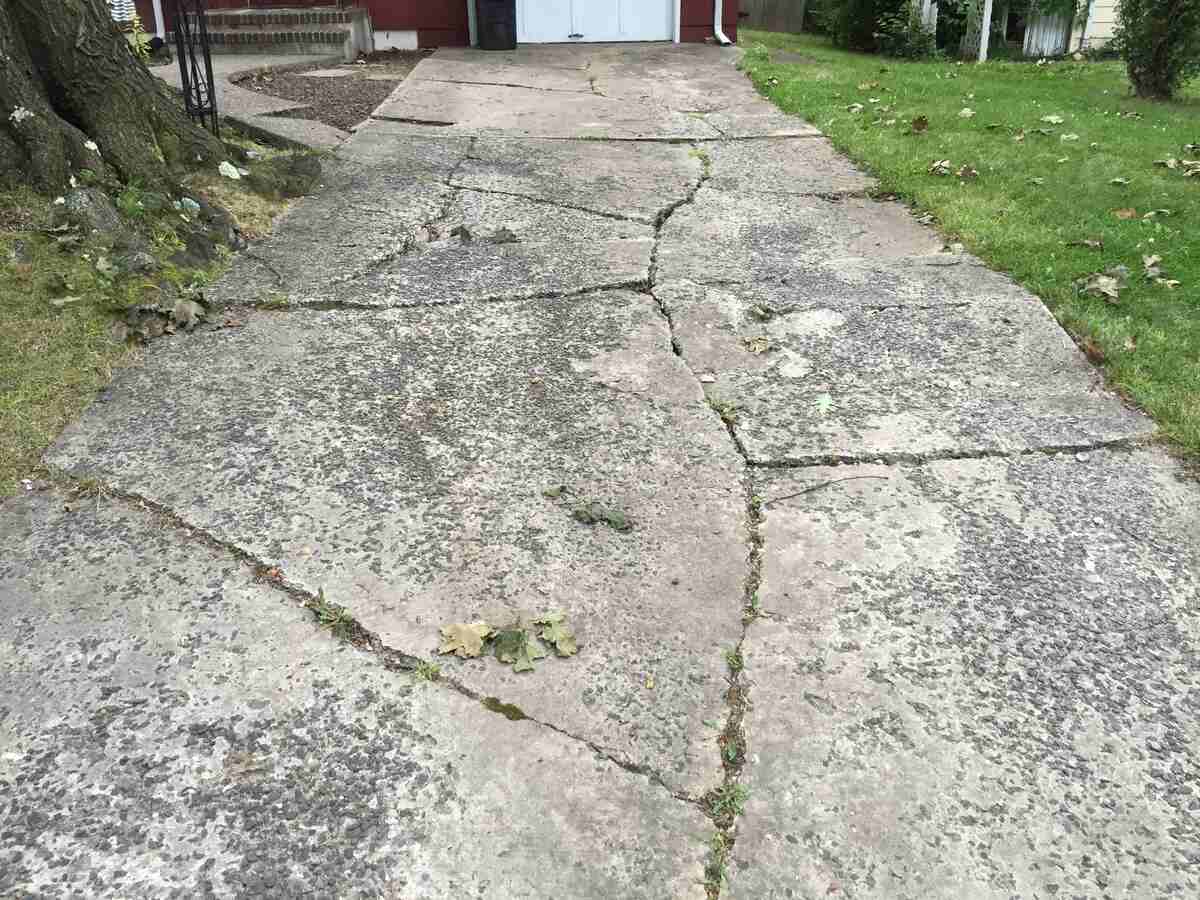 Cracks in a driveway of a house