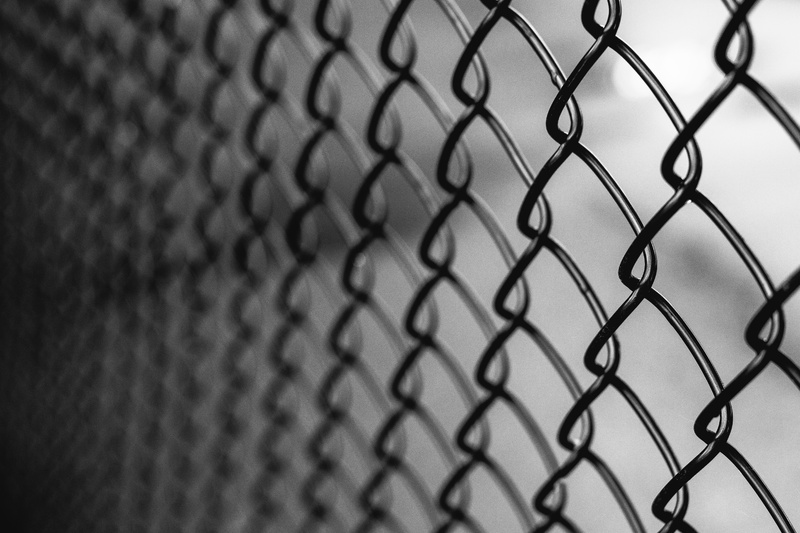 A Black chain link fence installed at boundary