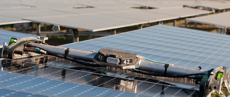 A solar panel cleaning robot cleaning the solar panels