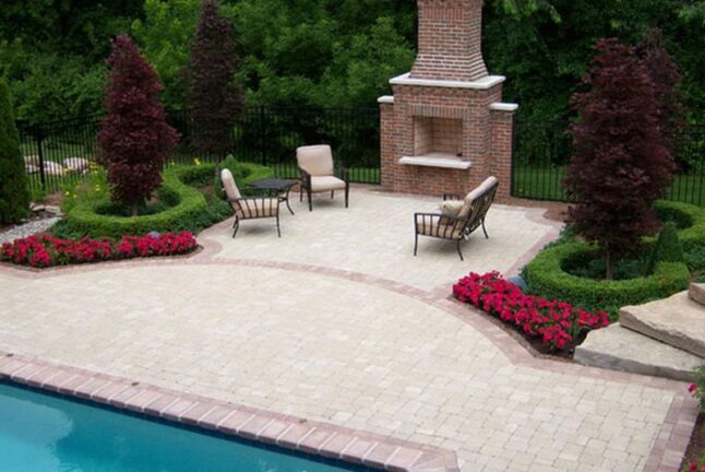 Fireplace beside a pool