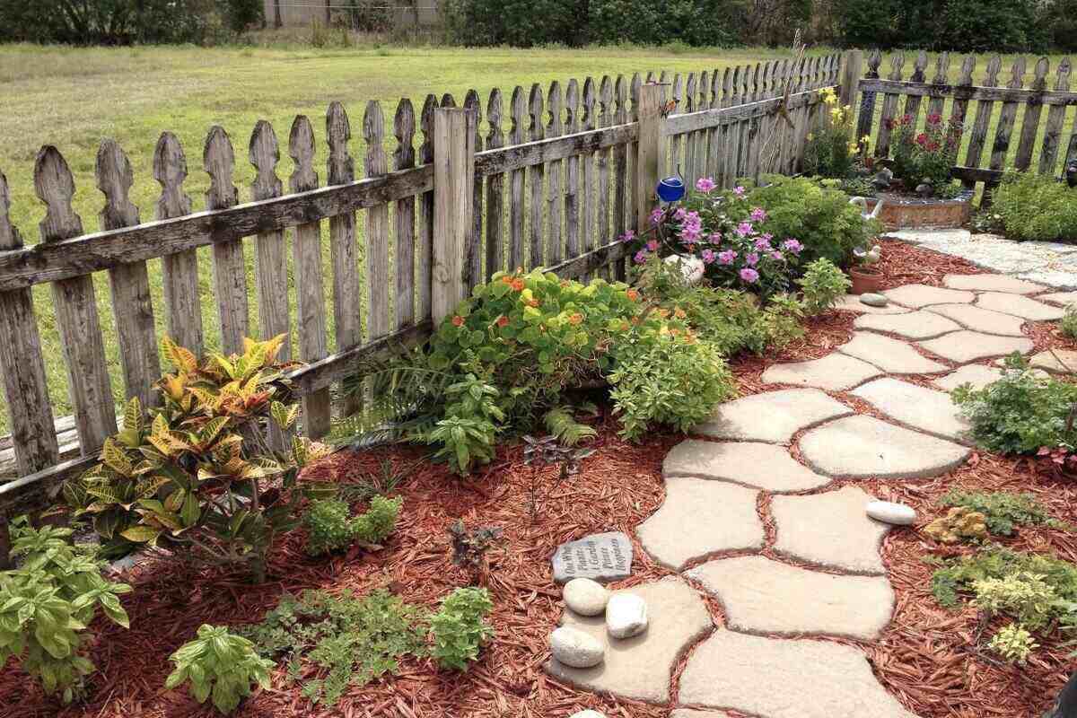 Stone Path Between the Garden with Wooden Fence