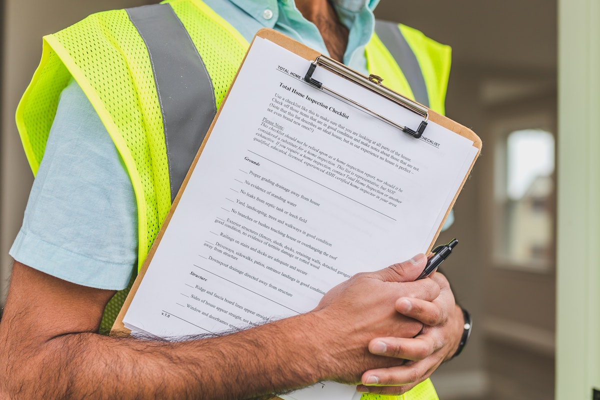 Man Holding Inspection list