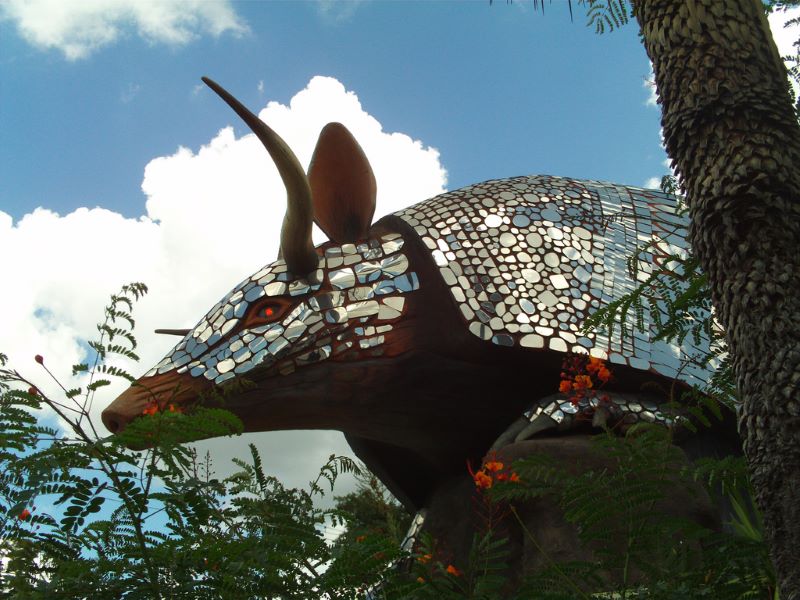 A giant armadillo statue stands to greet all who enter the Goode Company Armadillo Palace.