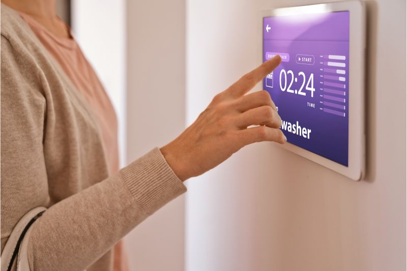 women activating a home security system