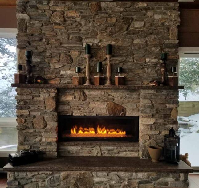 Natural, Rustic, Stone Fireplace With Roaring Flames in Winter