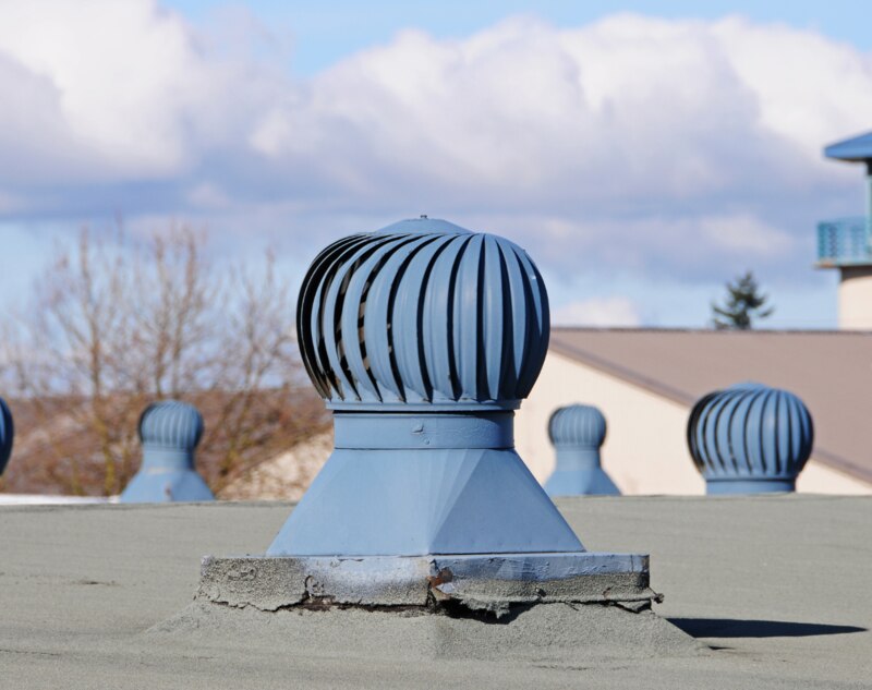Blue colored roof vents installed on a roof of house