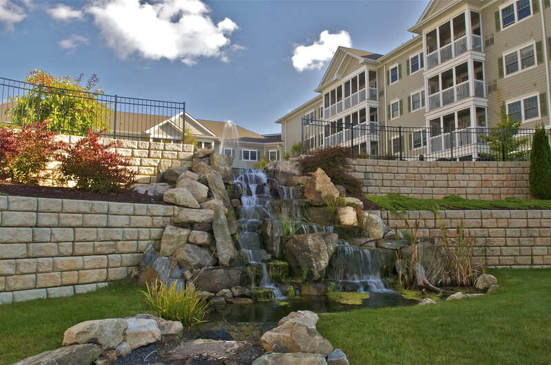 A waterfall built around a retaining wall