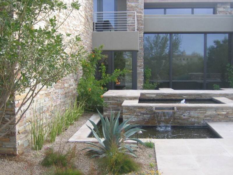 A water feature installed in alongwith plants