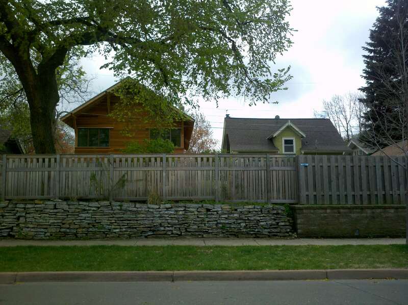 A protective fence built over a retaining wall