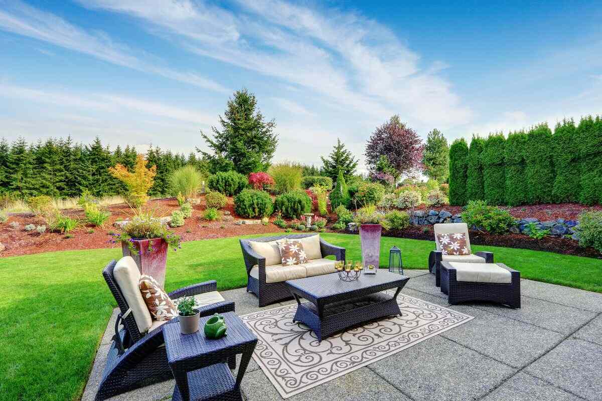 impressive landscape design of a yard with patio area