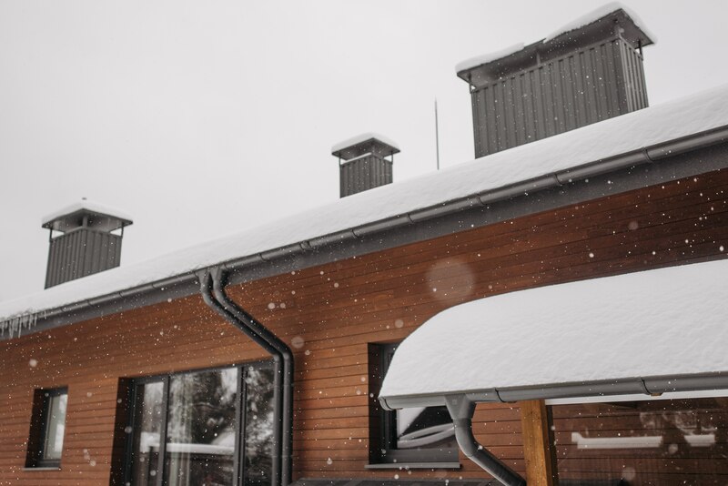 Snow piled up on a flat roof