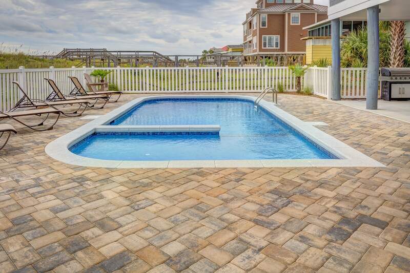 A white colored painted pool fence