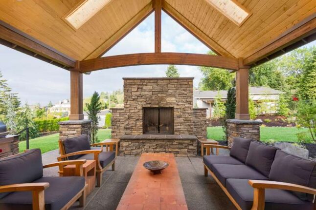 Covered patio with a fireplace with short chimney