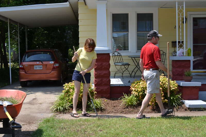 A person and his father doing yard cleaning