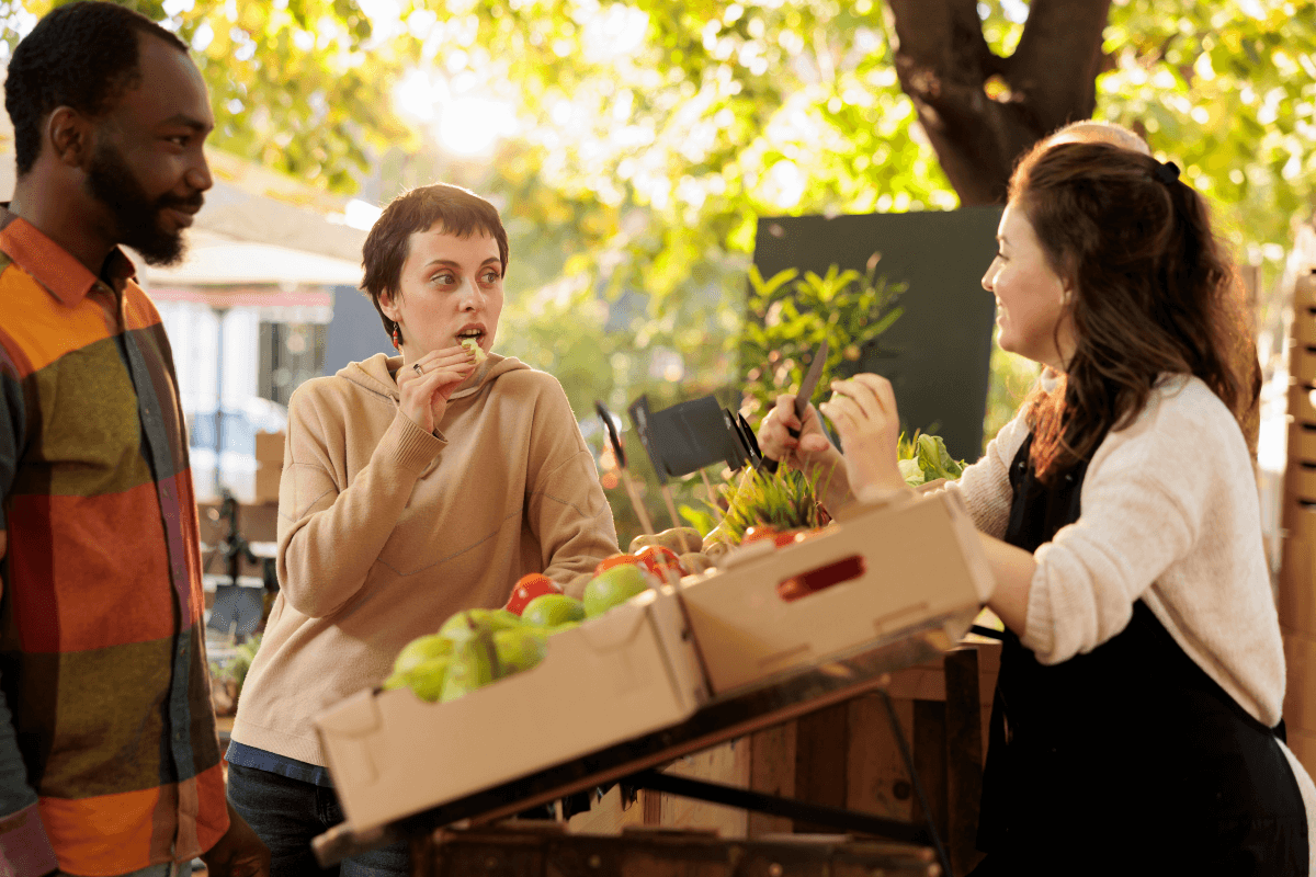 A couple samples locally grown fresh produce at a farmers market stall
