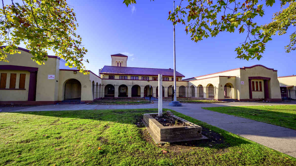 A grass lawn in front of a building in sacramento