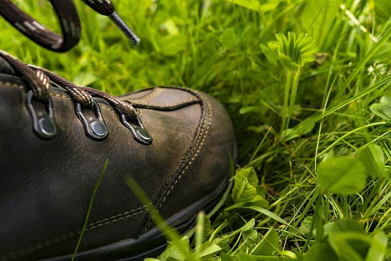 image of a person stepping on a grass