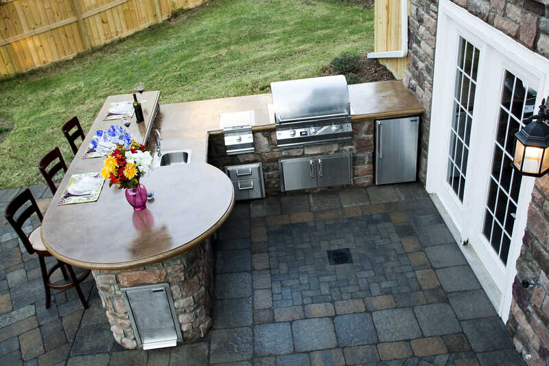 a beautiful hardscape in the lawn of a house