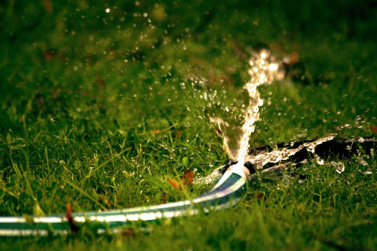 A picture showing a pipe watering lawn