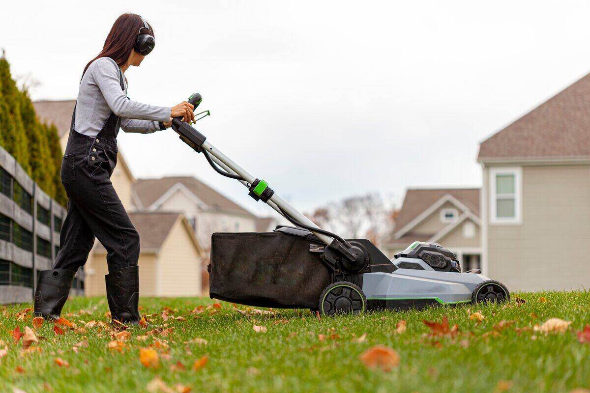 a person mowing a lawn