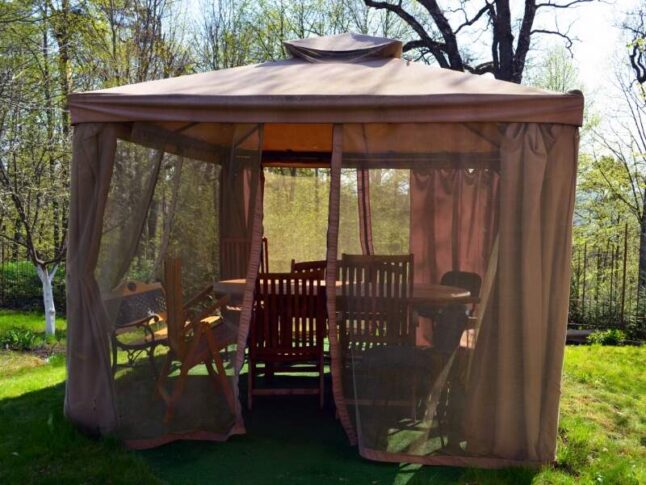 outdoor mosquito netting around a gazebo