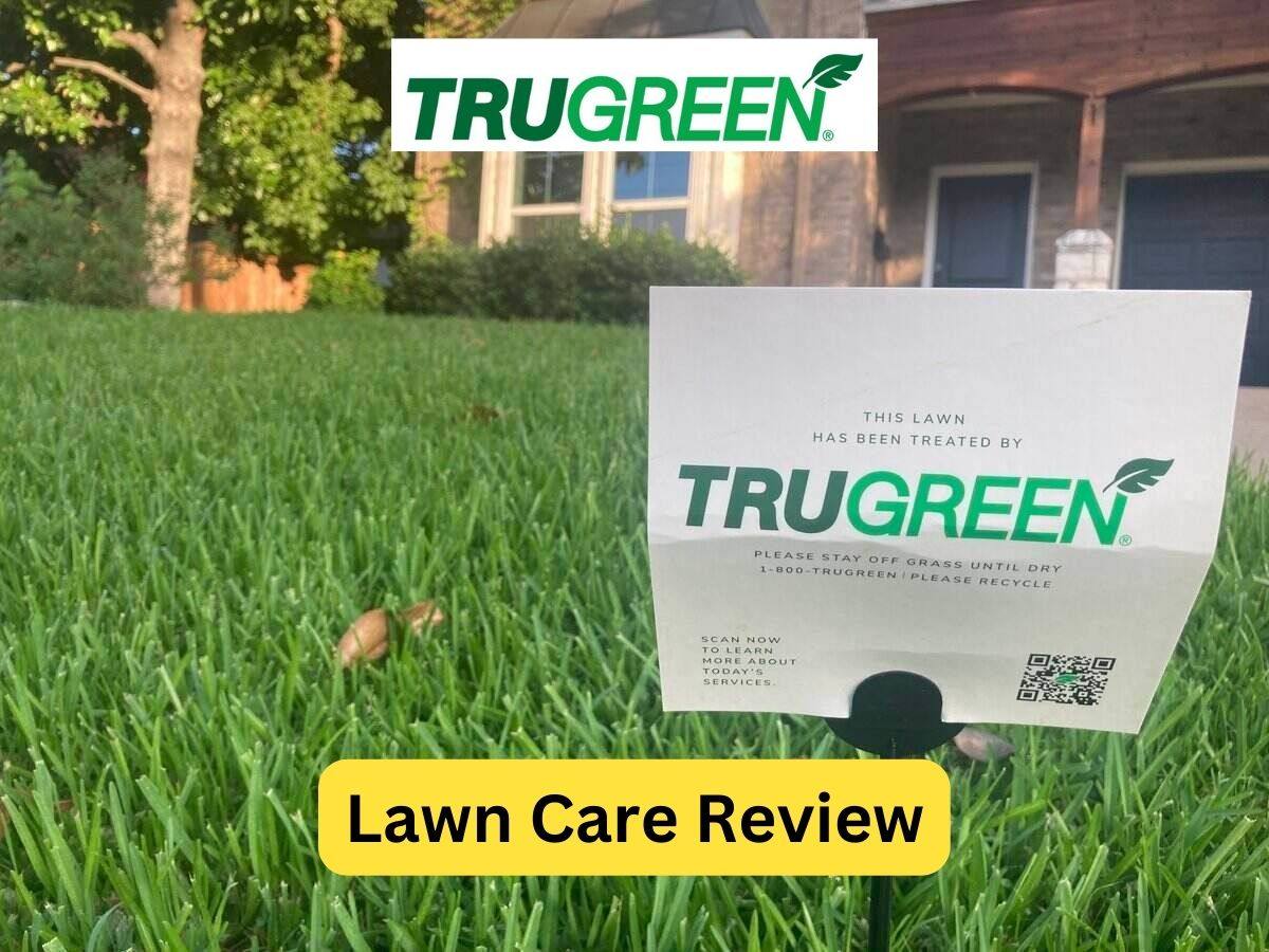 TruGreen lawn treatment sign in grass of the front yard of a home in Dallas with the TruGreen logo at the top and text overlay at the bottom