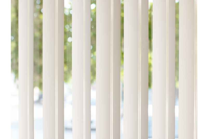 vertical blinds hanging in a room