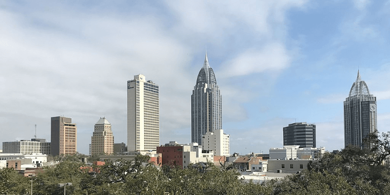 A couple of skyscrapers and numerous high-rises peek out from behind the trees in Mobile, Alabama.