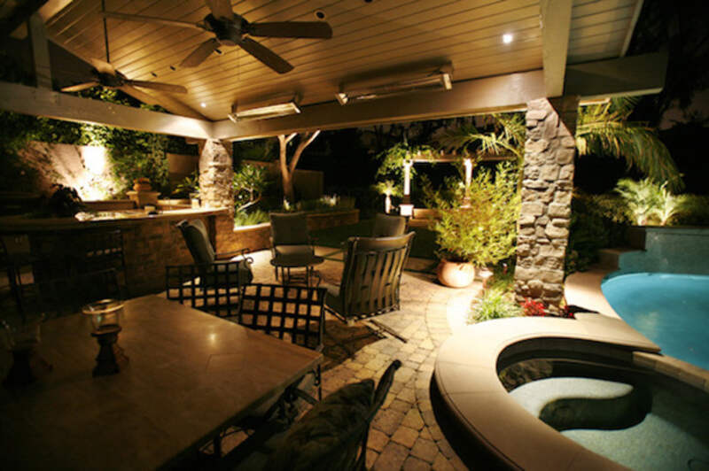 Outdoor living area with lights at night