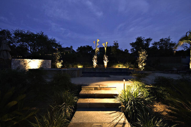 Light shines on outdoor stairs at night