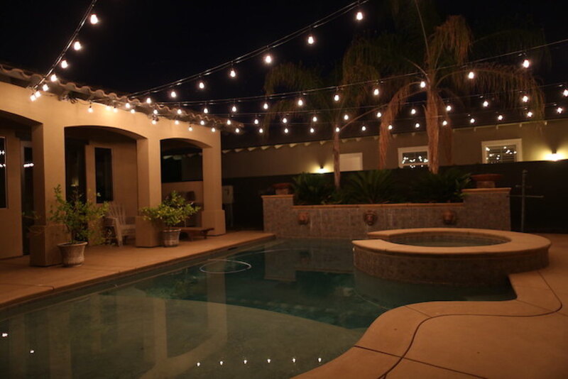 String lights light up a poolscape