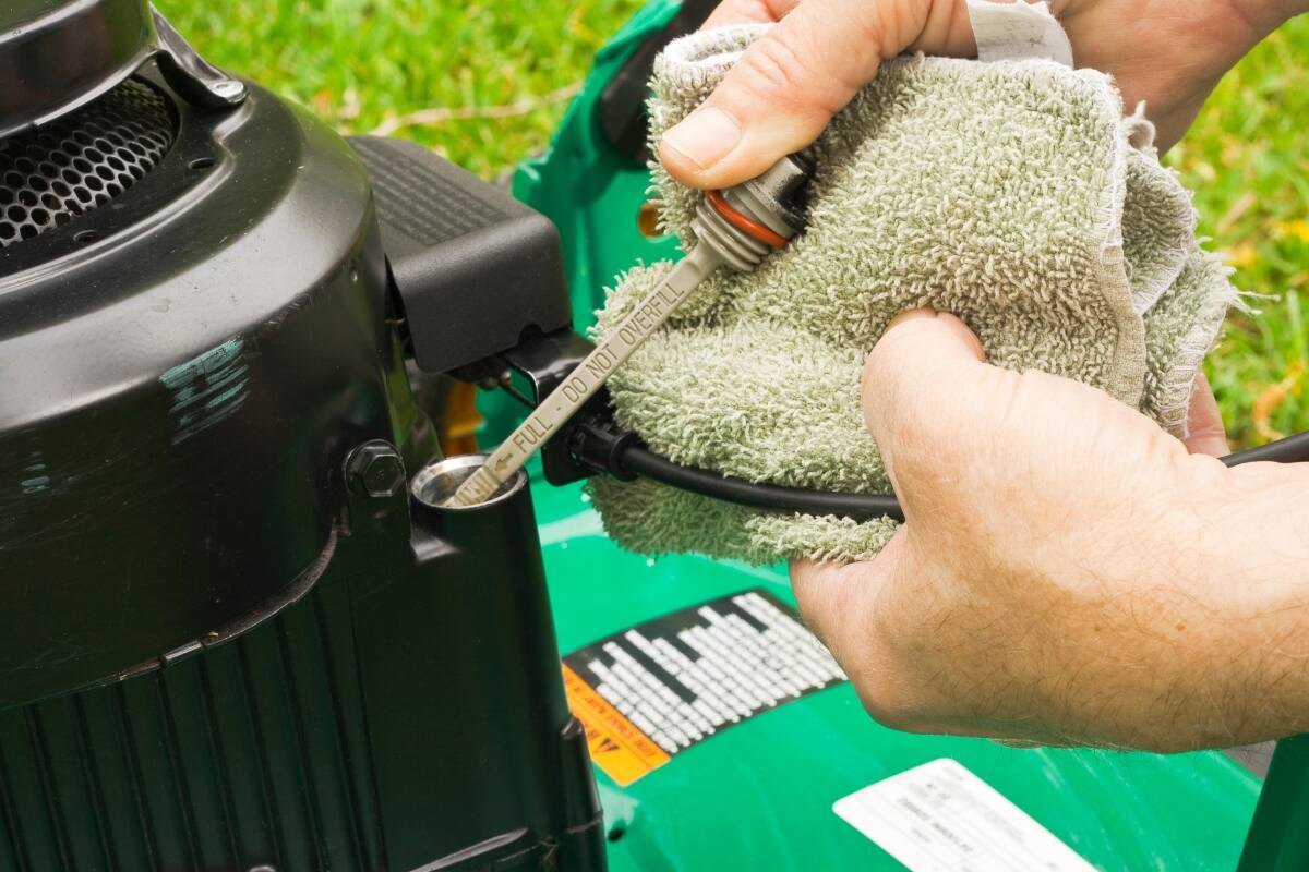 close-up of oil dipstick in a lawn mower