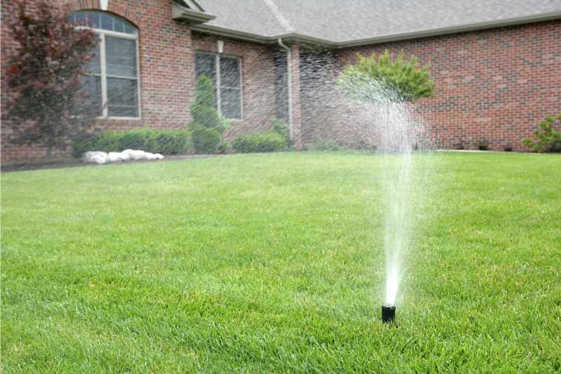 water coming out of a lawn sprinkler