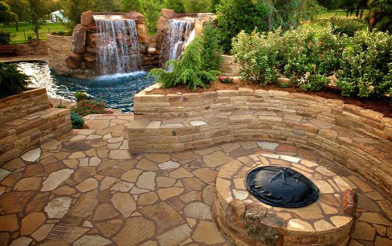 Flagstone Patio and seating area with a retaining wall