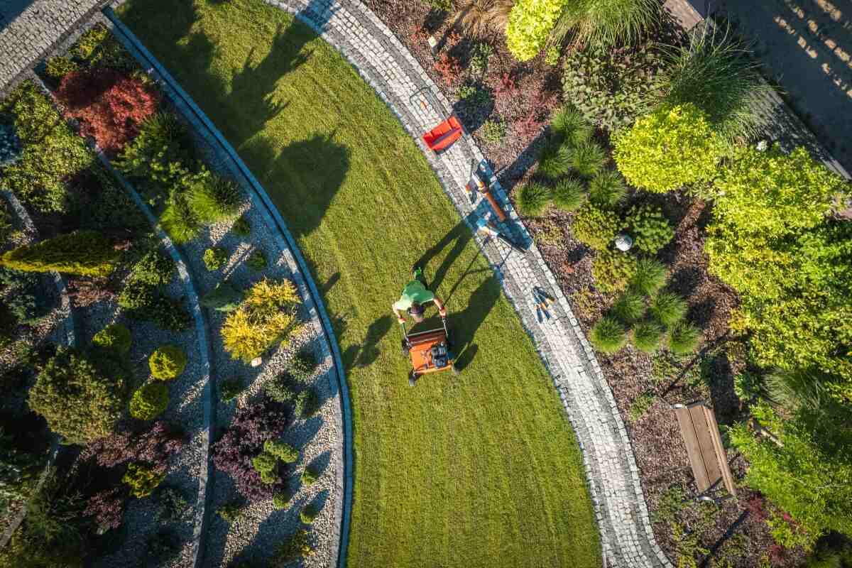 aerial view of landscaper aerating a lawn