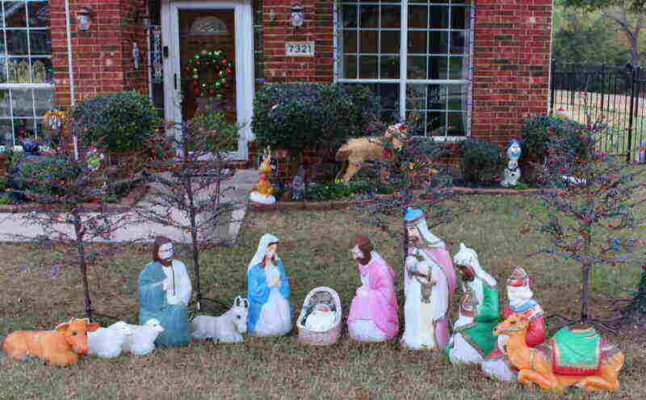 Holiday decorations on front lawn, complete Nativity set