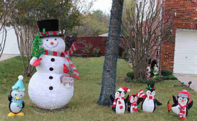 Holiday lawn decorations, snowman and penguins