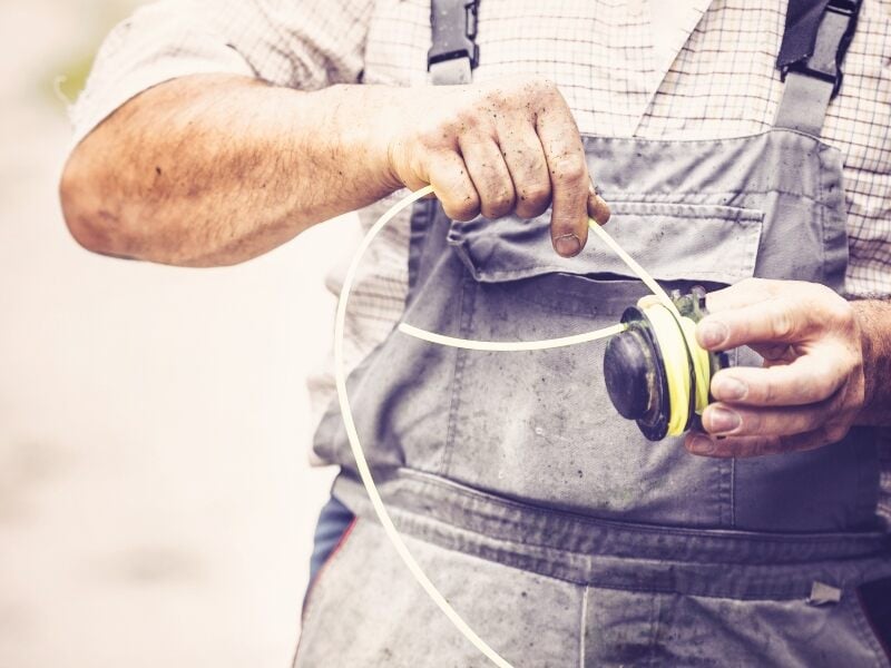 winding string around spool of string trimmer