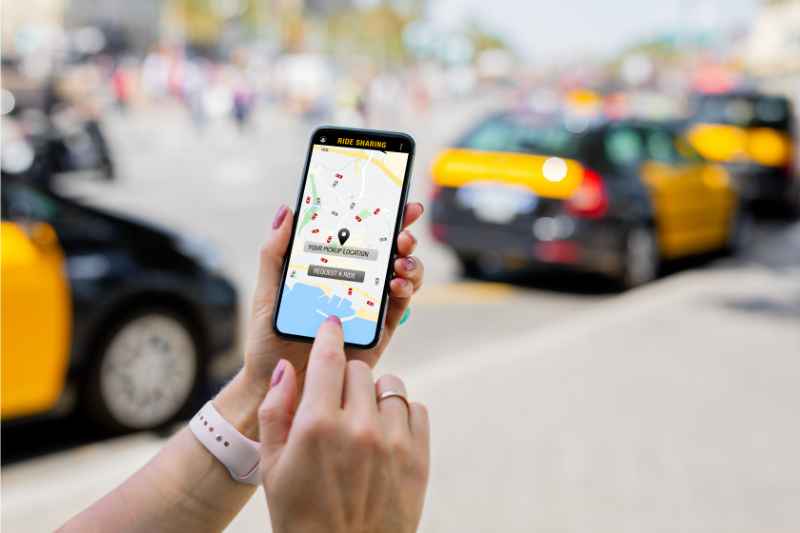 closeup of person using a ride sharing app