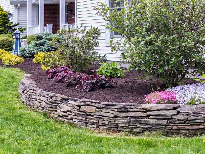 flowerbeds with fresh mulch and spring flowers