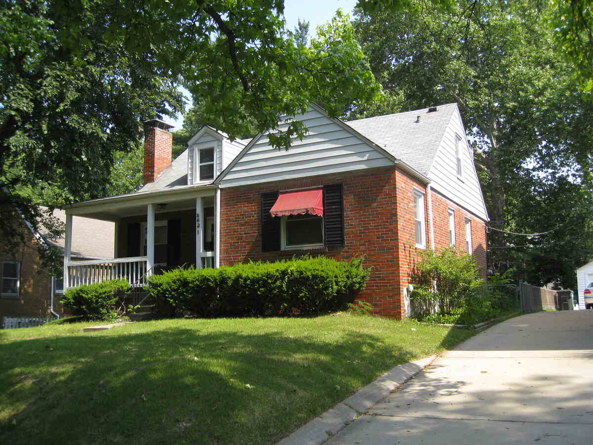 grassy lawn in front of a house