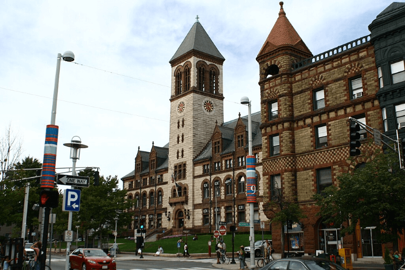 City hall in Cambridge, Massachusetts stands out on a street of historic buildings thanks to its Romanesque design and clock tower