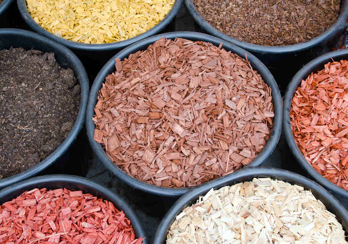 various types and colors of mulch in buckets