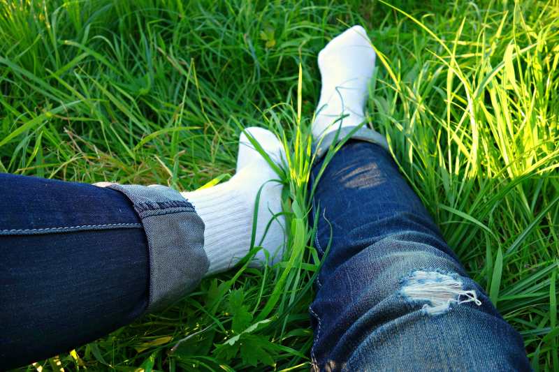 Person wearing white socks on grass