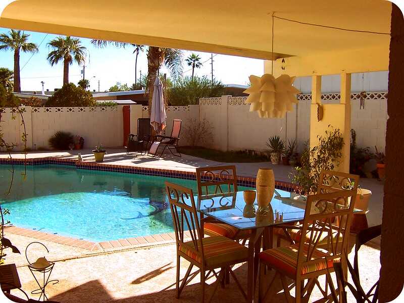 backyard pool with tall walls surrounding the backyard