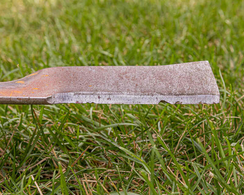 lawn mower blade that is rusty, damaged, dull and needs sharpened