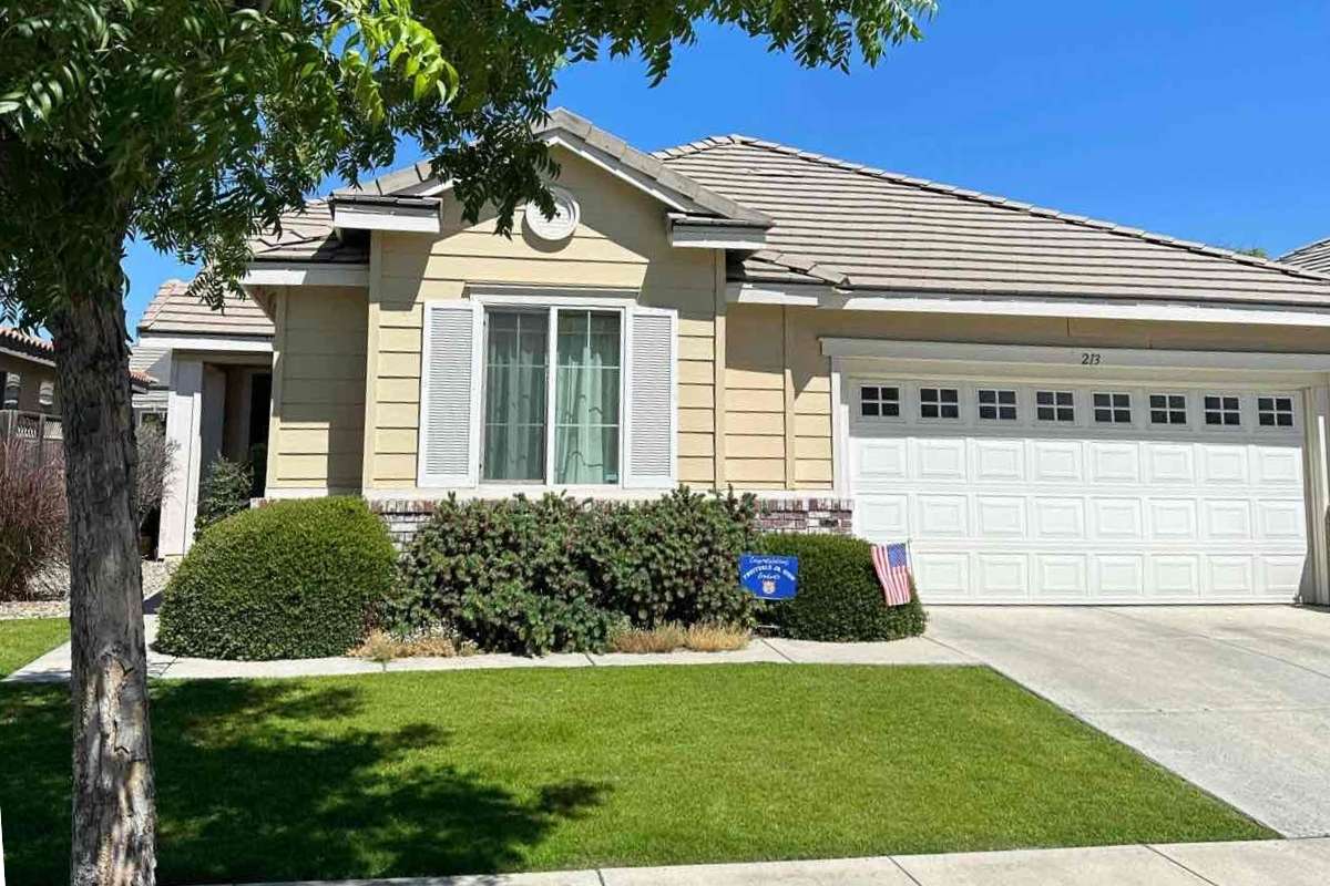 lawn in front of a house in Bakersfield, CA with sky in background