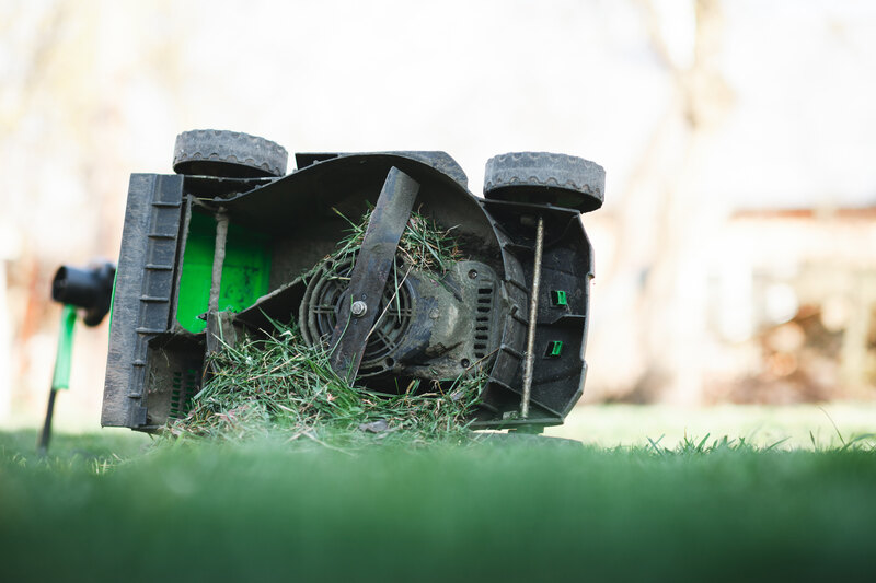Lawn mower blade, overflowing with grass